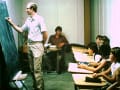 SS Class 1982 in NE stairwell, Creighton Gustafson at board and Tim Kremer seated)